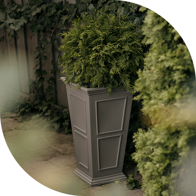 Brixton Tall planter against wooden fence