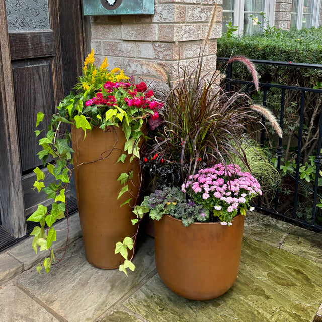 3 patina planters on front porch