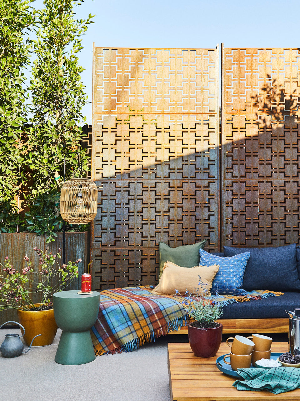 taking a blank concrete canvas to a cozy backyard hideaway: